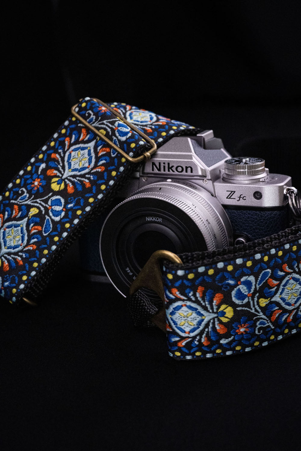 The Tribute blue camera strap