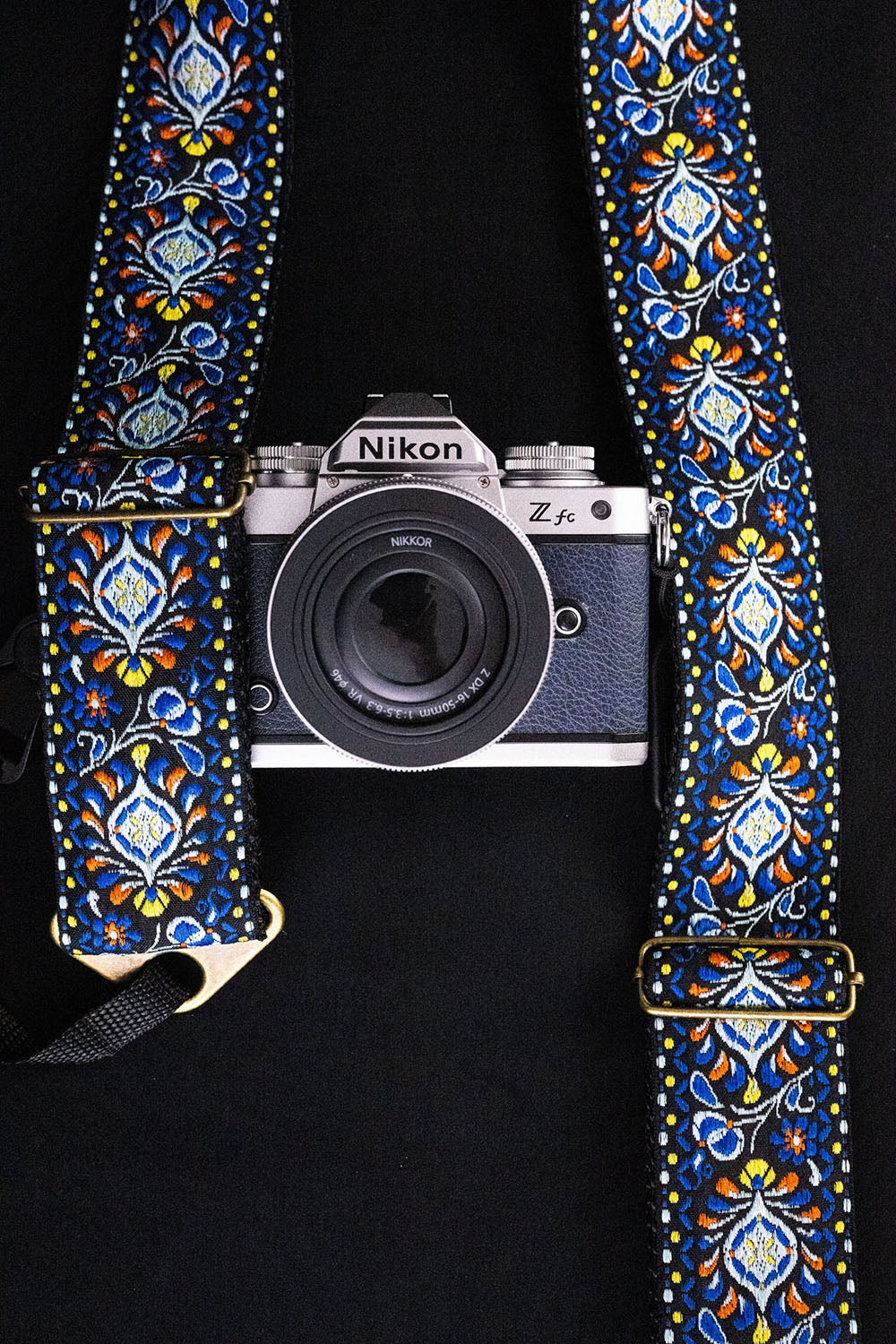 The Tribute blue camera strap